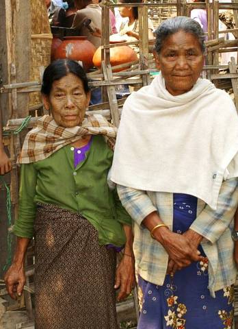 Two mother tattooed accept  easely the pose for my camera
The Chin tribe people , are one of the large ethnic minority groups in Burma. The Chin people are of Tibeto-Burman groups and they probably ca