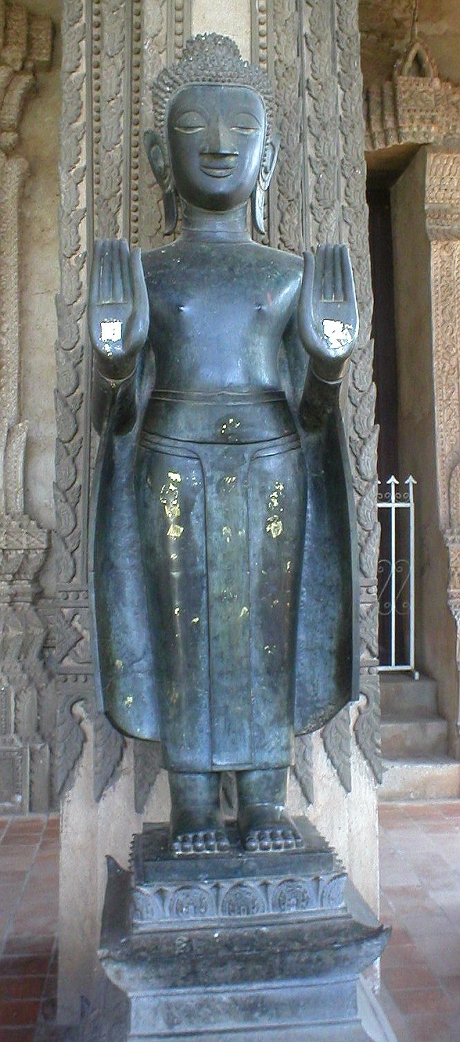 Lao Buddha amulet (Luang Prabang and Vientiane temple issues) — Museum of Ho Phra Keo (Vientiane, Laos). Bouddha statue, bronze XVIII th century (outside gallery).
Myself-made picture.