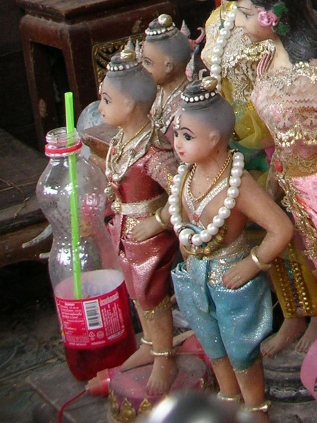Kuman Thong (raised child-spirit) — Kuman Thong figures at a shrine in Ratchaburi Province