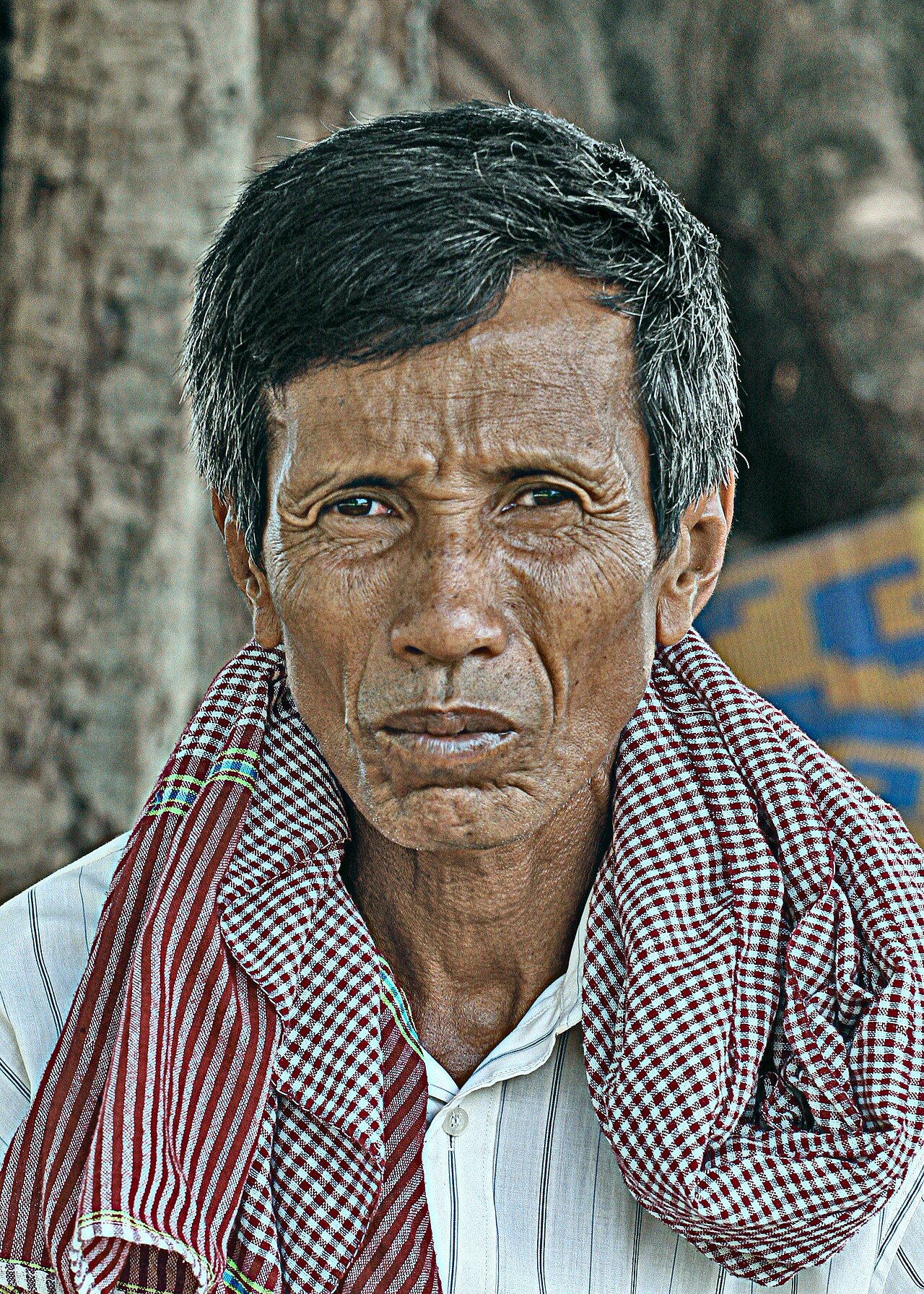 Khmer yantra cloth — Cambodian man with a krama around his neck