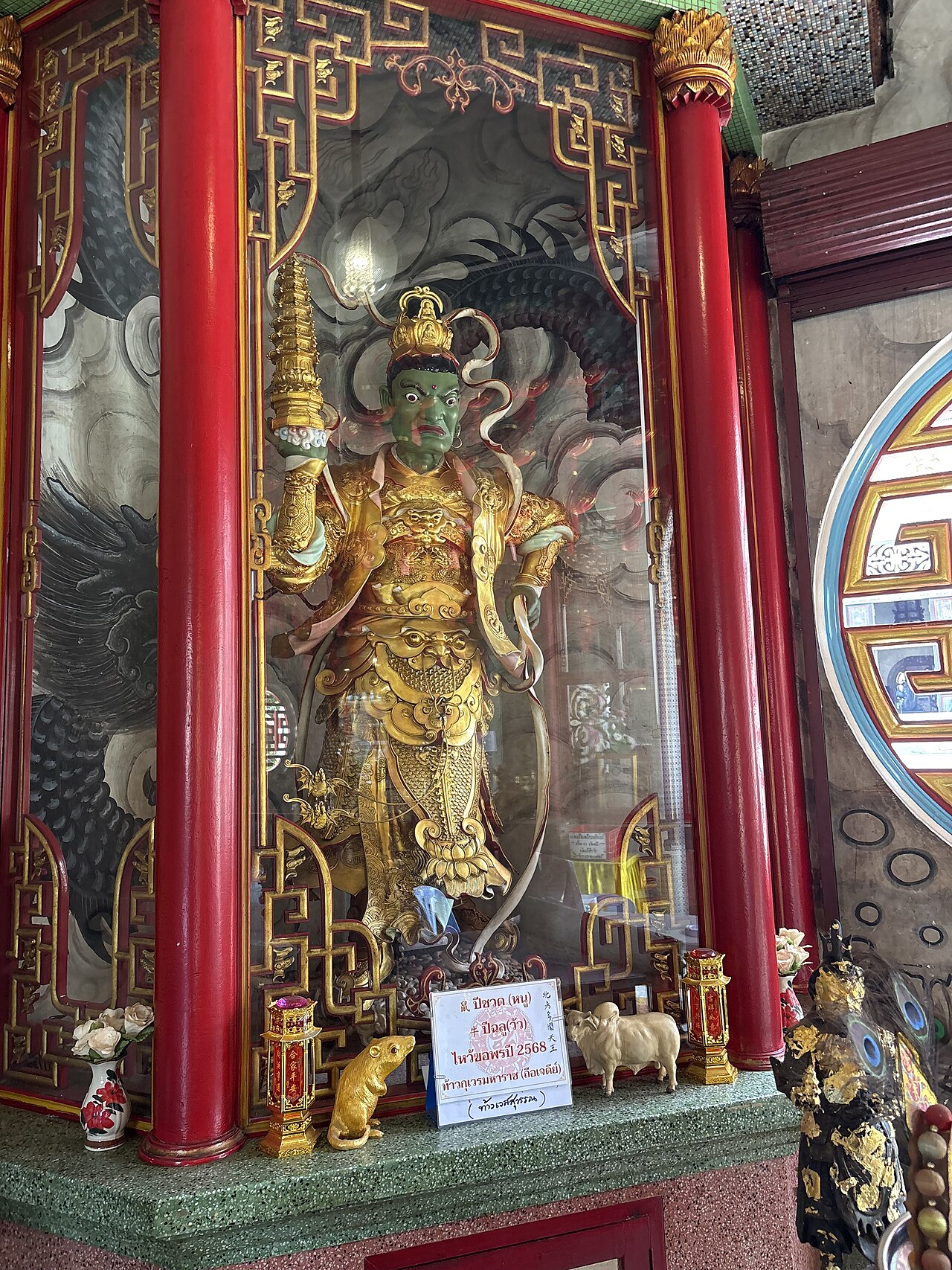 Thao Wessuwan (guardian-king of the yaksha) — Kubera in the Hall of Four Heavenly Kings, Wat Bhoman Khunaram, Bangkok