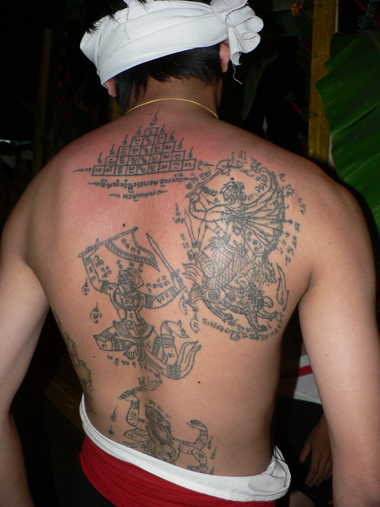 In (Burmese cabalistic square) — Thai tattoos. Chiang Mai 2005