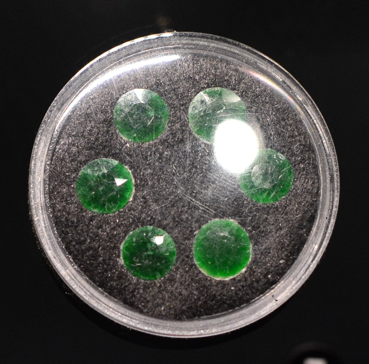 Burmese jadeite Buddha pendant — Burmese jadeite faceted stones (Myanmar). Burke Museum, University of Washington, Seattle, Washington. Acquisition numbe