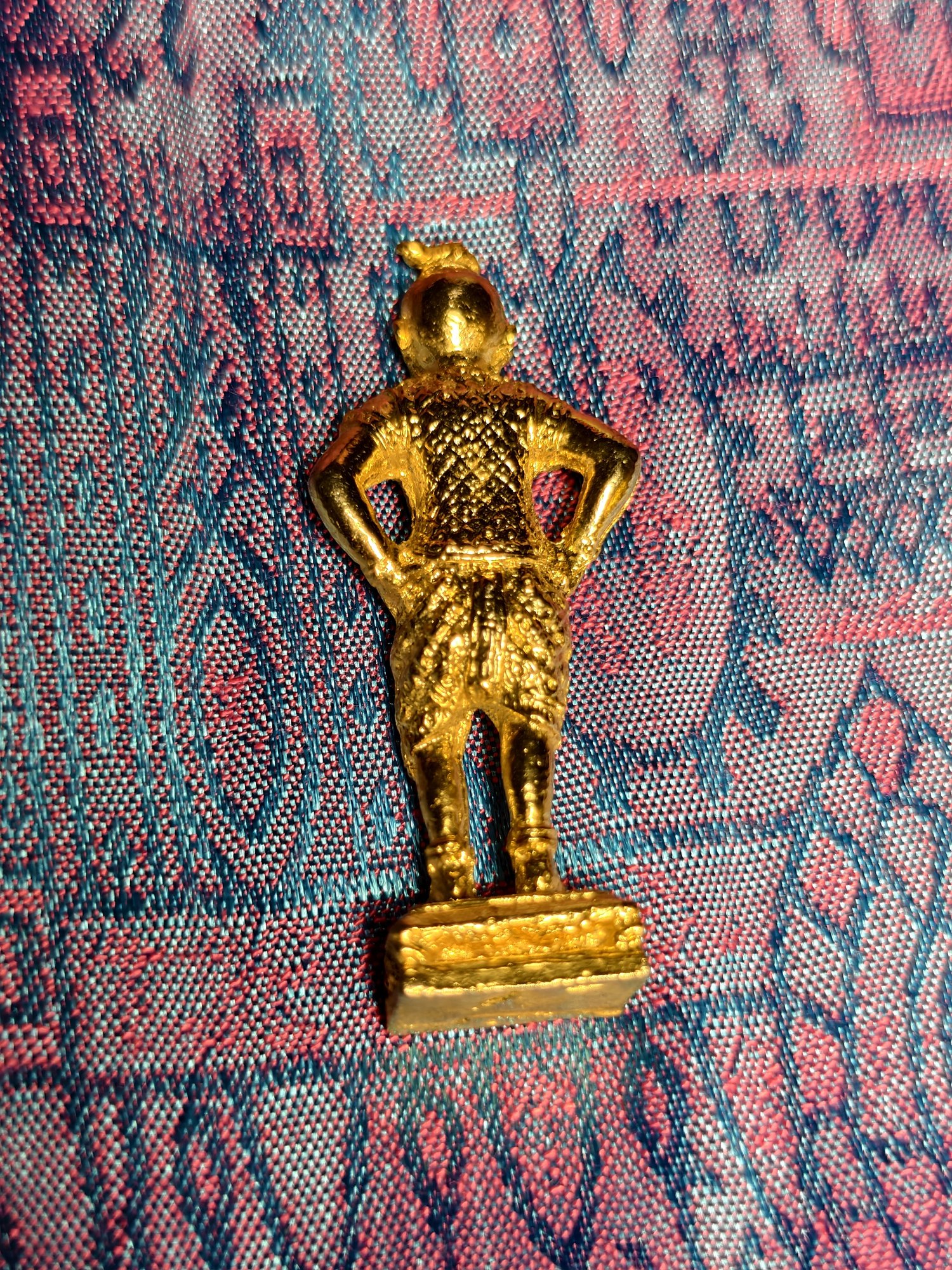 Standing gilt figure in a helmet, photograph 1