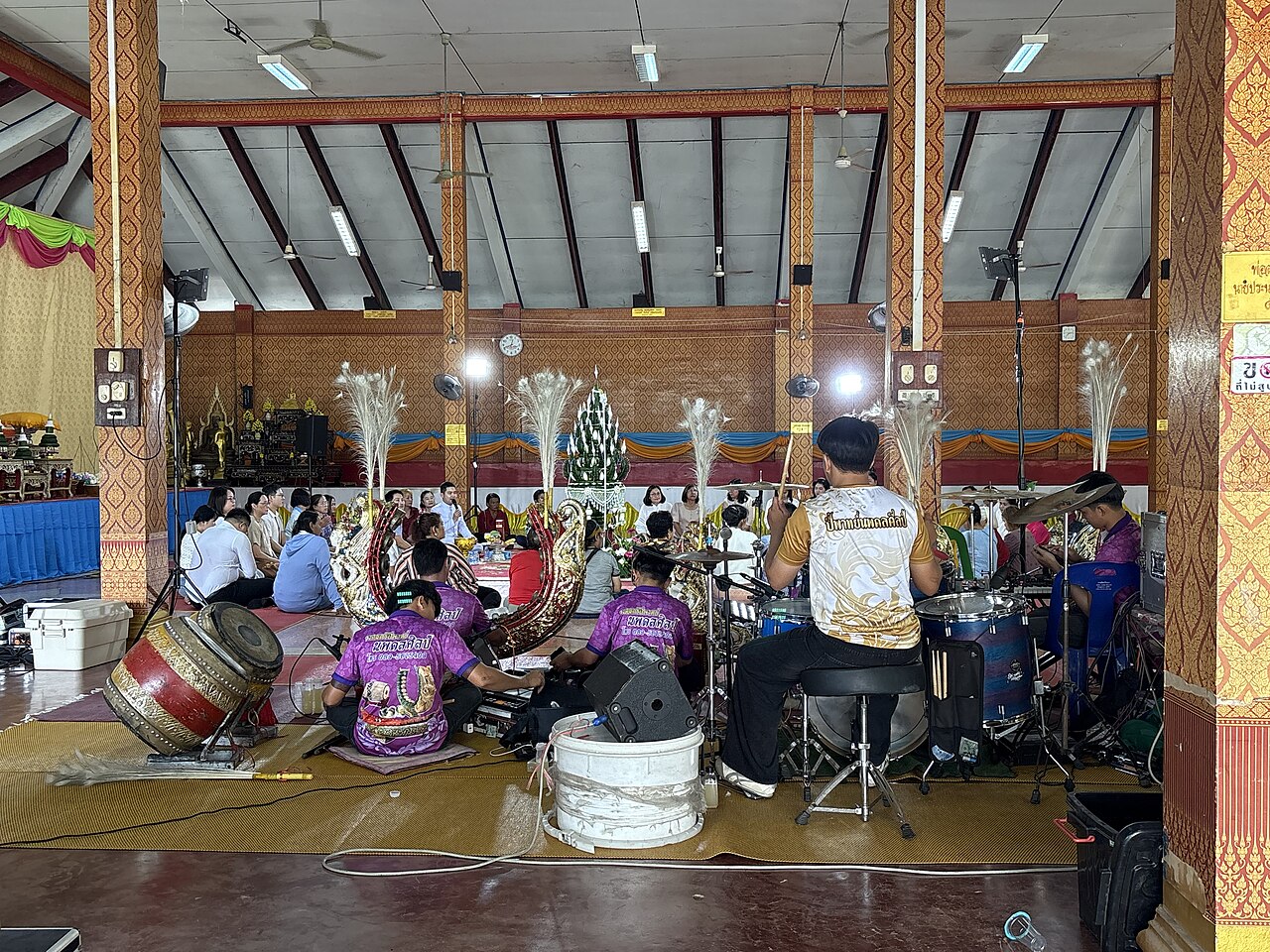 Sai sin (blessed cotton thread) — A Buddhist ordination ceremony at Wat Kong Krailat, Kong Krailat district, Sukhothai province