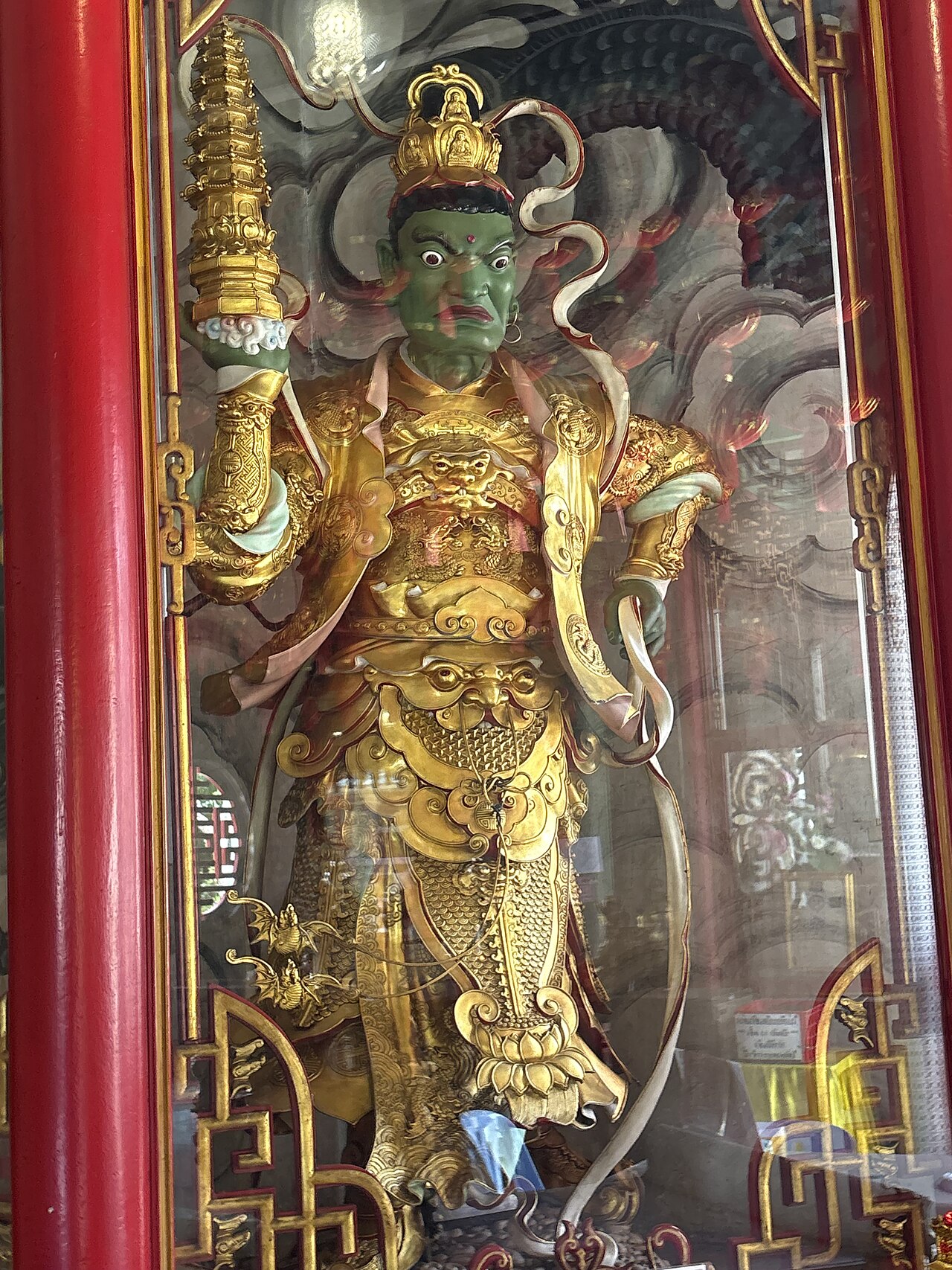 Thao Wessuwan (guardian-king of the yaksha) — Kubera in the Hall of Four Heavenly Kings, Wat Bhoman Khunaram, Bangkok