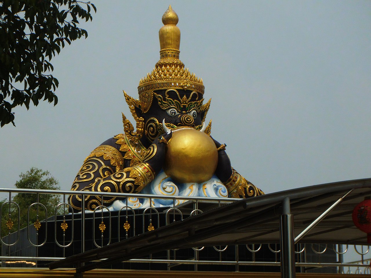 Phra Rahu (the eclipse-swallower) — This is a photo of a monument in Thailand identified by the ID