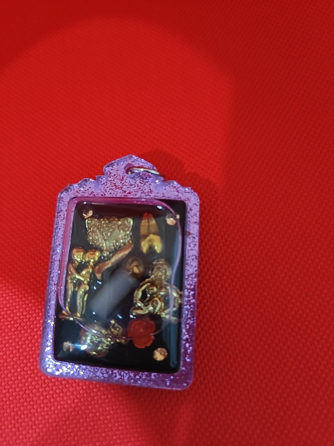 Gambling amulet: small charms set in resin, purple frame, photograph 4