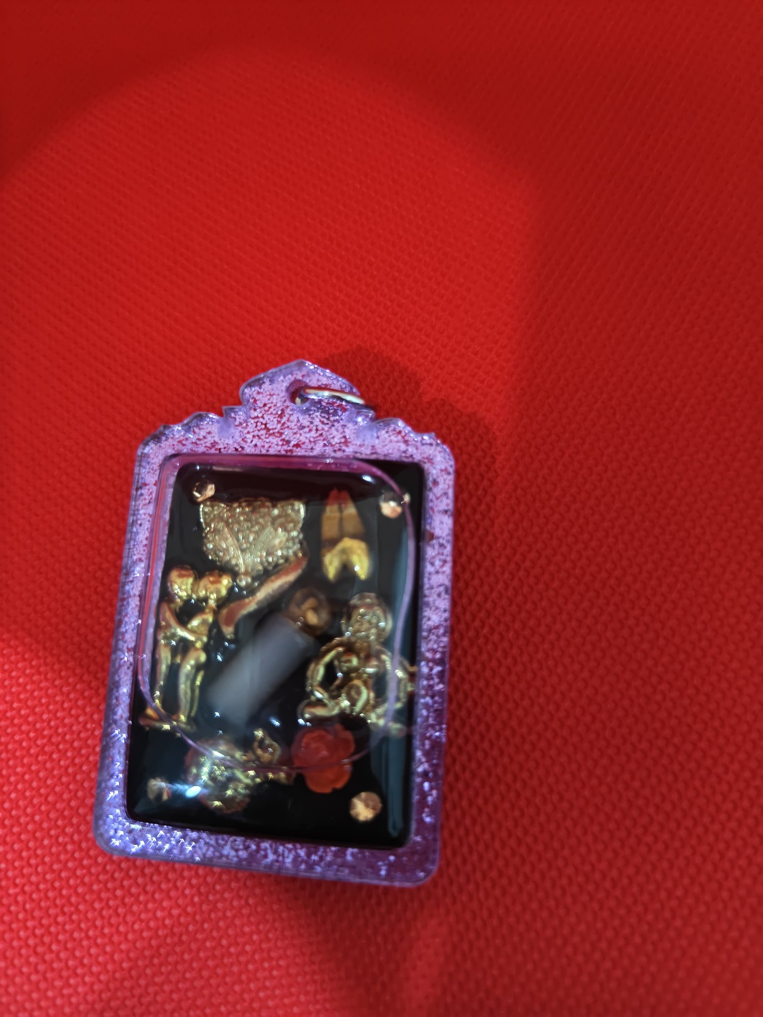 Gambling amulet: small charms set in resin, purple frame, photograph 3