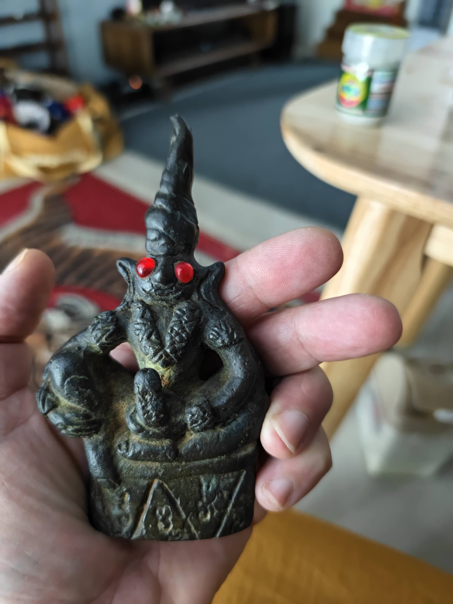 Ngang, bronze, red eyes, photograph 3