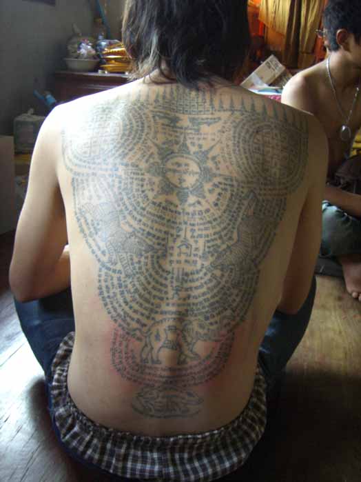 In (Burmese cabalistic square) — Devotee of Wat Bang Pra covered in Yant Tattoos

fotographer; Spencer Littlewood