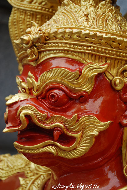 Phaya Khrut (the garuda) — A close-up shot of a red cloured Thai Garuda also known as Thai: ครุฑ krut. This garuda is one of the two statues found