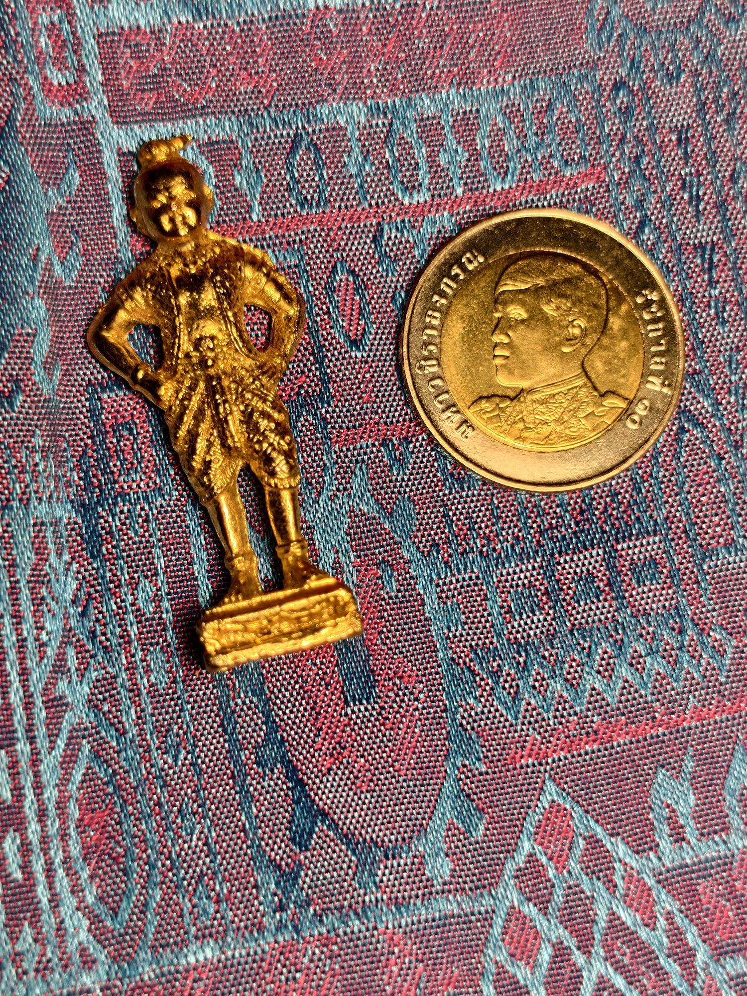 Standing gilt figure, fists on hips, photograph 2
