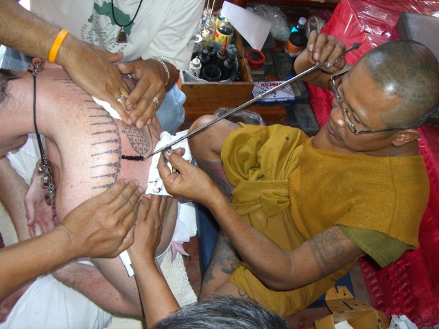 In (Burmese cabalistic square) — Hlwong Pi Pant tattooing a Yant in Ang Tong Province.

Fotographer - Spencer Littlewood