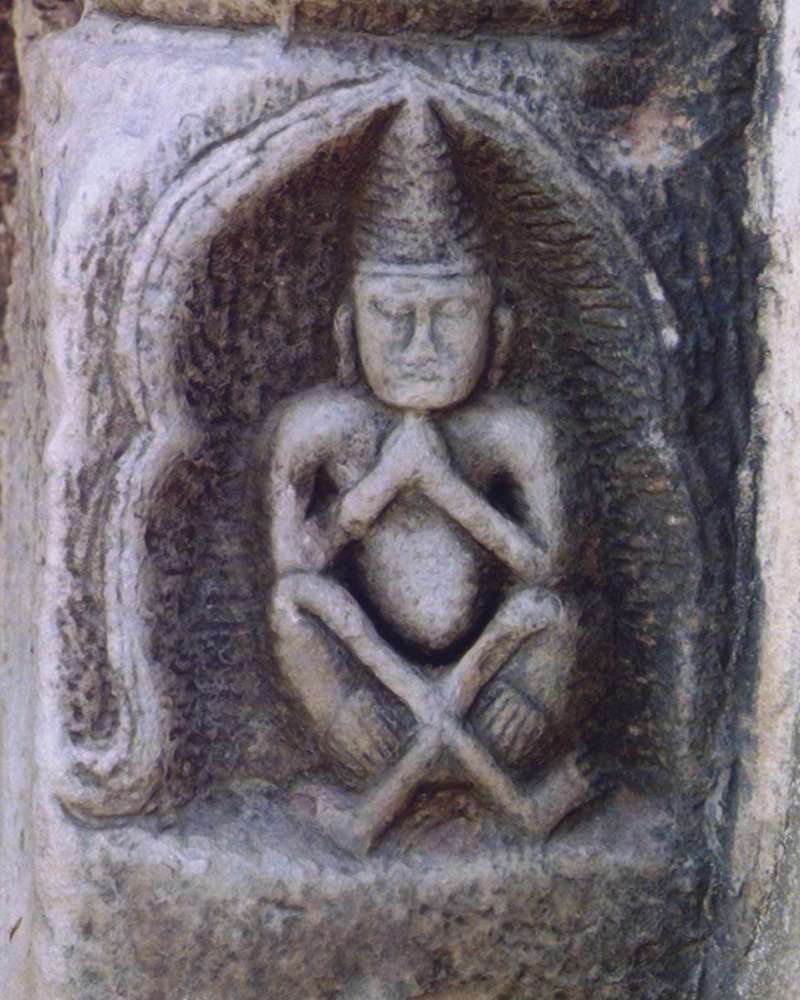 Phra Lersi figure (the hermit-teacher) — Carving of Rishi in the base of a colonette of the southern door of Prang Sam Yod, Lopburi, Thailand. 
Photo taken by Us