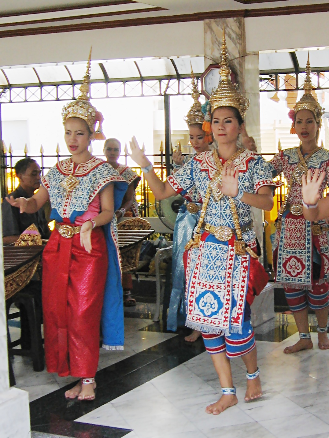 Four-faced Brahma pendant — Traditional Thai dance performed for Brahma god at Erawan Shrine, Bangkok, Thailand.