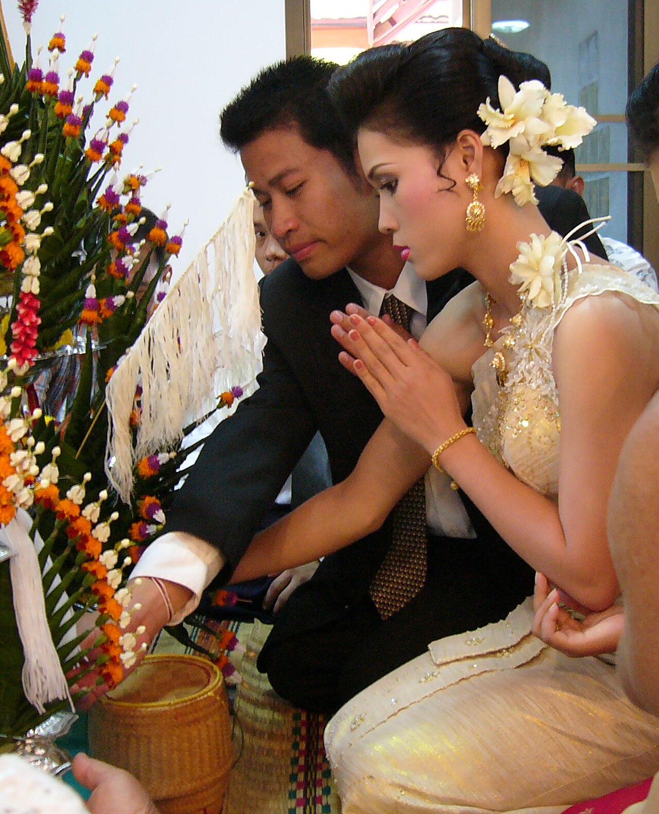 Sai sin (blessed cotton thread) — Part of a Marriage ceremony in Thailand, 2007.