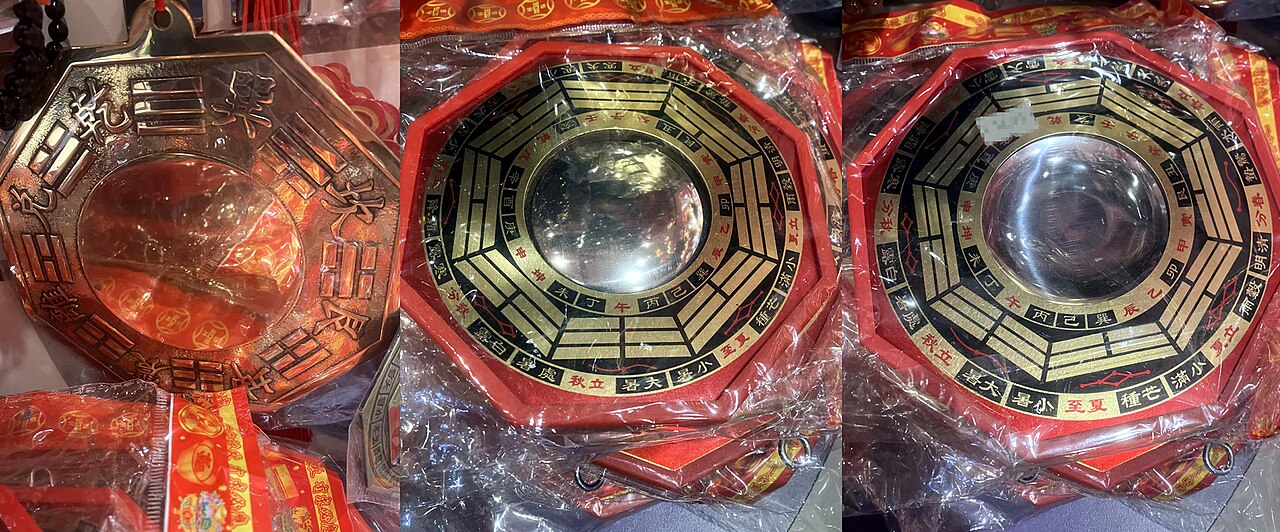 Bagua mirror — Three variants of modern bagua mirror talismans. From left to right: Flat variant (with embossed trigrams on a metallic