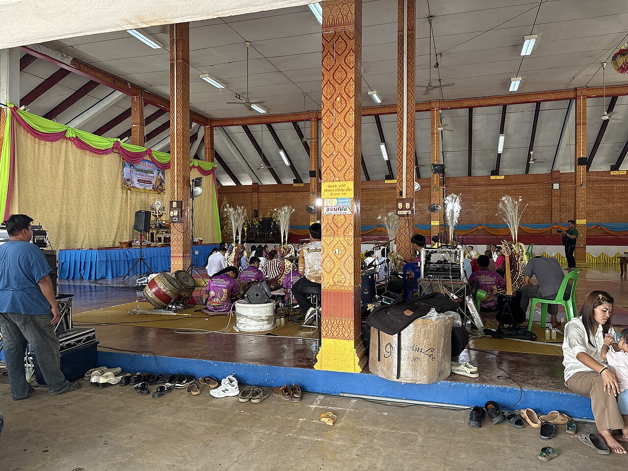 Sai sin (blessed cotton thread) — A Buddhist ordination ceremony at Wat Kong Krailat, Kong Krailat district, Sukhothai province