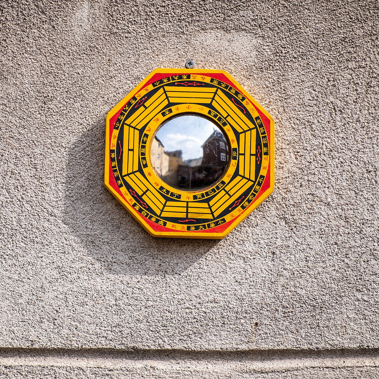 Bagua mirror — Feng Shui Bagua mirror above the front door of the house at Hollenbeckerstraße 24, Münster, North Rhine-Westphalia, Germ