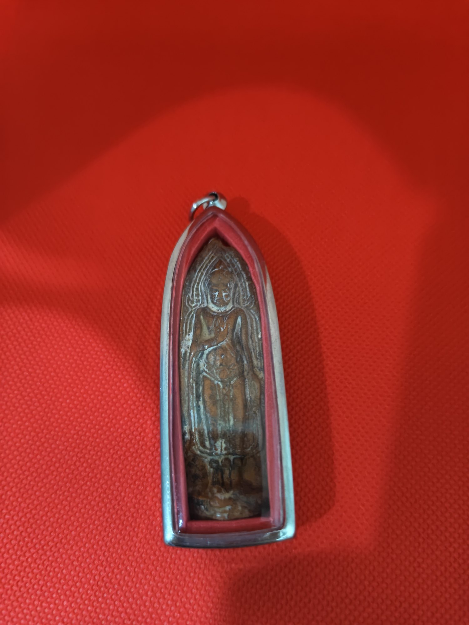 Standing Buddha in a tall case, photograph 1