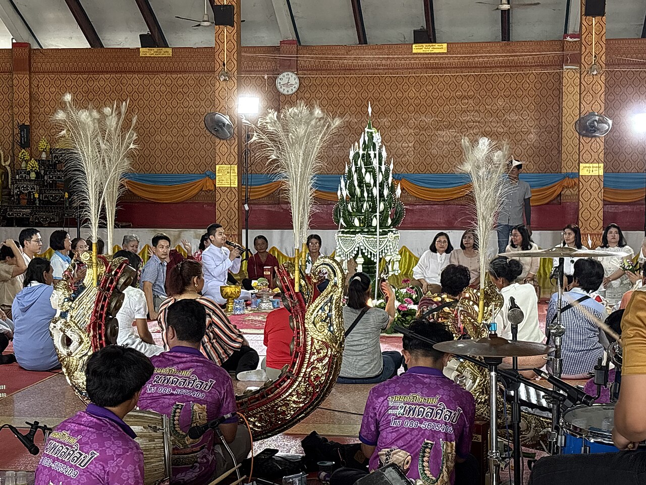 Sai sin (blessed cotton thread) — A Buddhist ordination ceremony at Wat Kong Krailat, Kong Krailat district, Sukhothai province