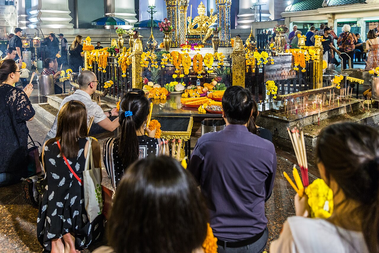 Four-faced Brahma pendant — Worshippers at the Erawan Shrine in Bangkok