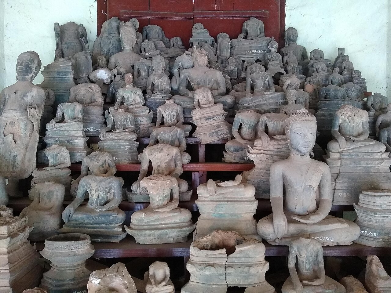 Lao Buddha amulet (Luang Prabang and Vientiane temple issues) — A collection of 18th-century bronze Buddha statues from temples in Vientiane, damaged when Laos was invaded in 1826-1828