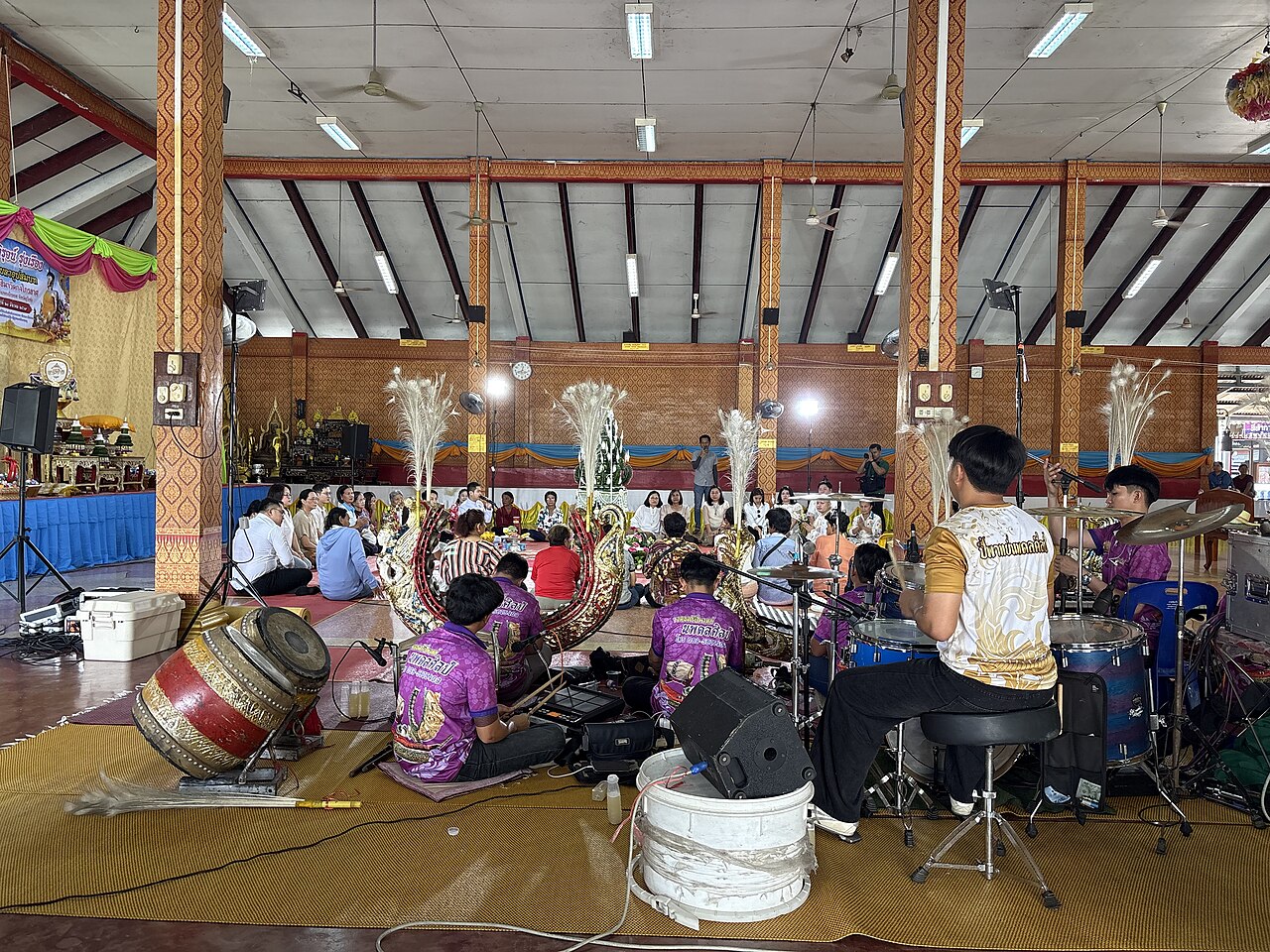 Sai sin (blessed cotton thread) — A Buddhist ordination ceremony at Wat Kong Krailat, Kong Krailat district, Sukhothai province