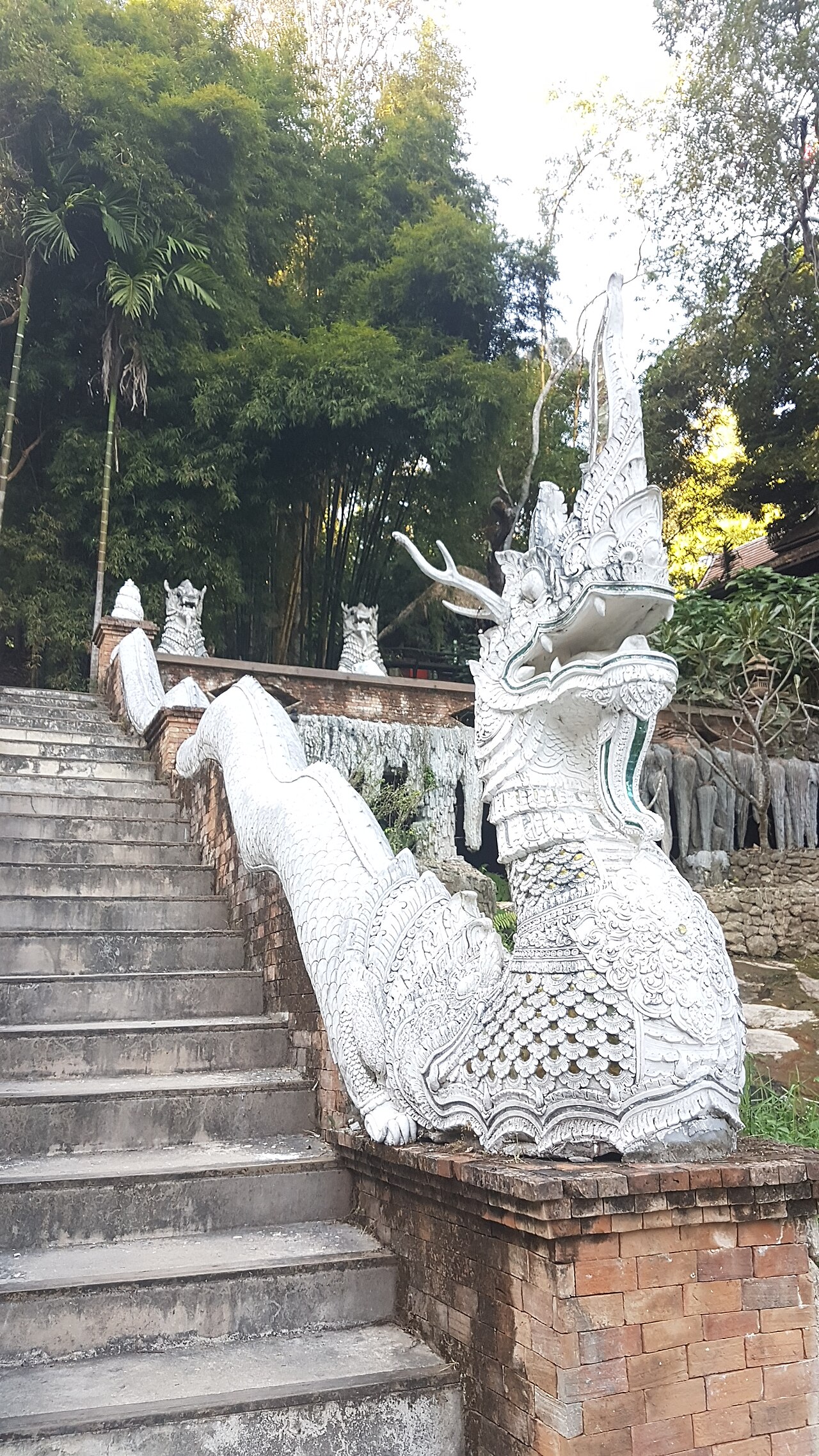 Naga pendant — Mythological creatures at Wat Sakithaka