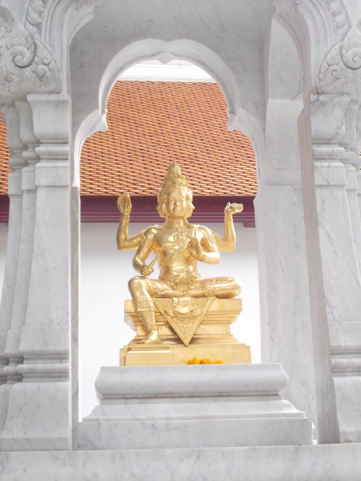 Four-faced Brahma pendant — This is a photo of a monument in Thailand identified by the ID
