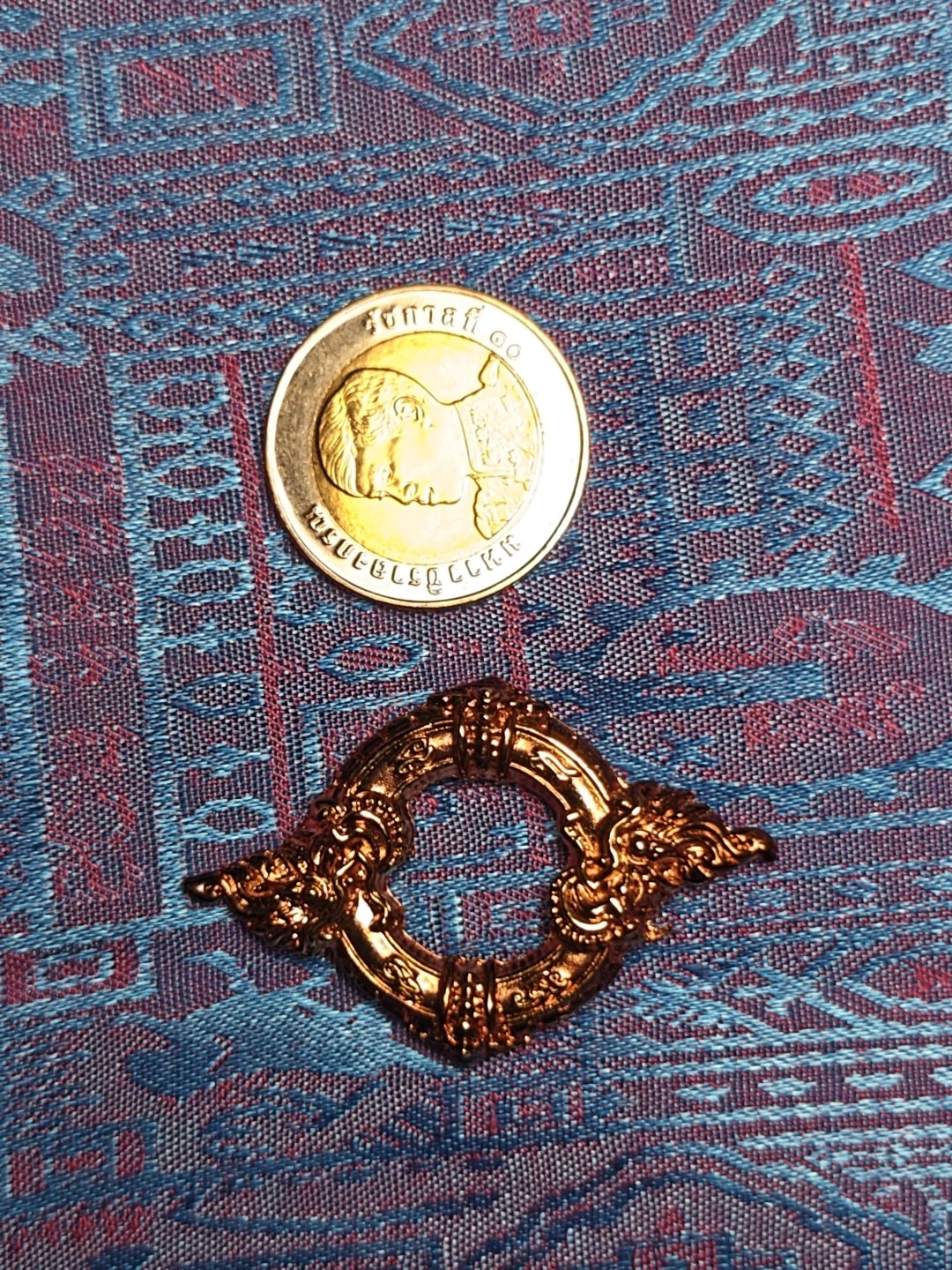 Two copper nagas encircled, photograph 1