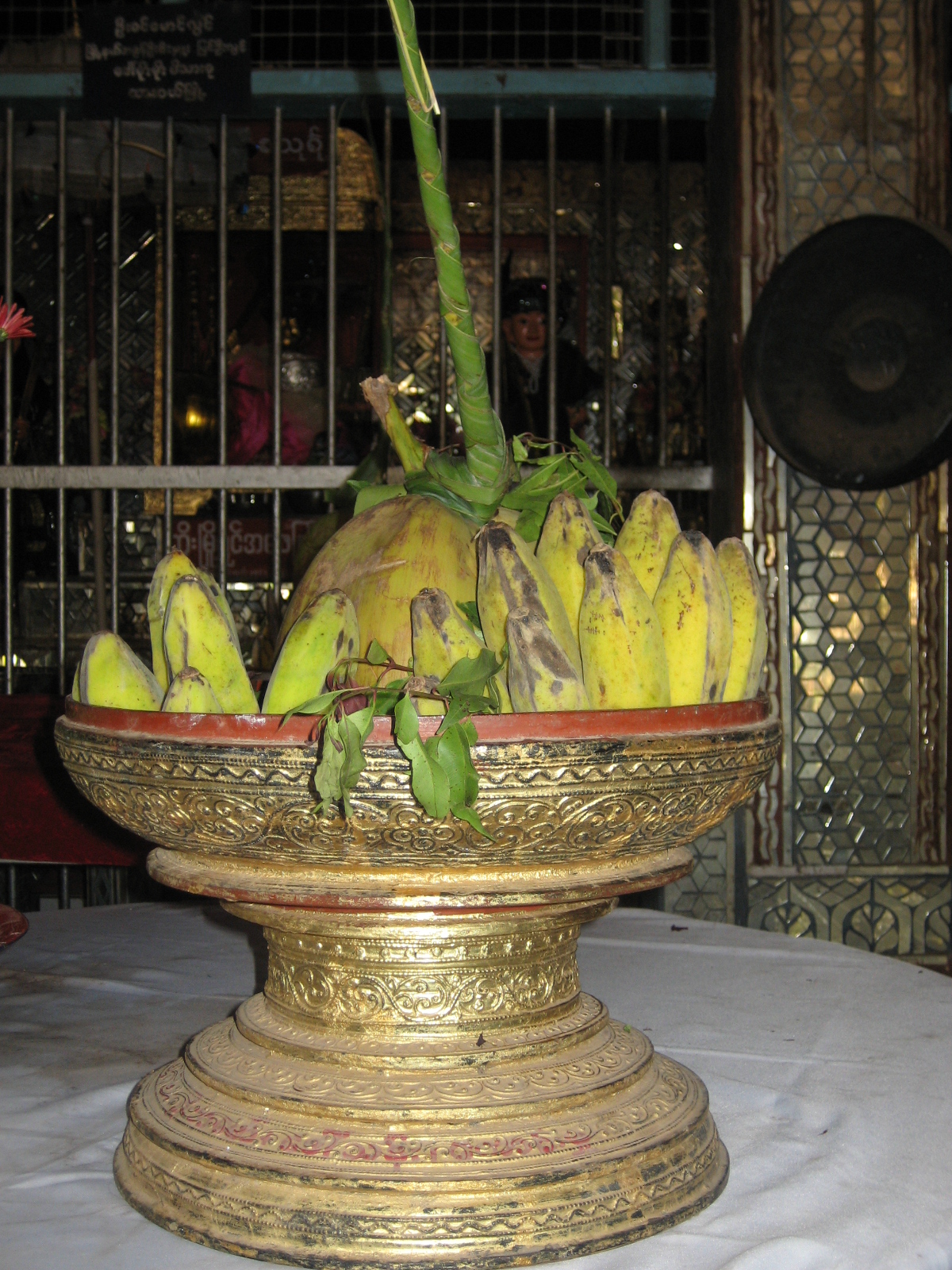 Nat figure (Burmese spirit-deity) — Traditional offerings of bananas and coconut at a Nat shrine in Myanmar